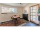 Eat-in kitchen with a dining area bathed in natural light, complemented by a charming stone-tiled floor at 1118 Glenwood Se Ave, Atlanta, GA 30316
