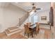 Warm dining area featuring hardwood floors, natural light, and an adjacent staircase at 1118 Glenwood Se Ave, Atlanta, GA 30316