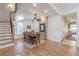 Charming dining room with wood floors, exposed brick, and a staircase at 1118 Glenwood Se Ave, Atlanta, GA 30316
