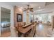 Open-concept dining area with exposed brick wall and wooden table, flowing into the living room at 1118 Glenwood Se Ave, Atlanta, GA 30316