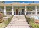 Inviting stairway to a beautiful home with cozy porch, rocking chairs, and lion statues at 1118 Glenwood Se Ave, Atlanta, GA 30316