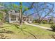 Charming two-story home with a large front yard, sidewalk, and mature trees at 1118 Glenwood Se Ave, Atlanta, GA 30316