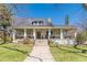 Charming two-story home with a inviting front porch, manicured lawn, and mature trees at 1118 Glenwood Se Ave, Atlanta, GA 30316