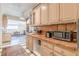 Kitchen with tile countertops, modern appliances, and an open layout into the breakfast area at 1118 Glenwood Se Ave, Atlanta, GA 30316