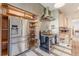 Stylish kitchen with stainless steel refrigerator, open shelving, and professional-grade stove at 1118 Glenwood Se Ave, Atlanta, GA 30316