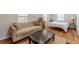 Cozy living room with hardwood floors, a comfortable couch, and natural light at 1118 Glenwood Se Ave, Atlanta, GA 30316