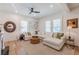 Inviting living area with a white sectional sofa, hardwood floors, and modern decor at 1118 Glenwood Se Ave, Atlanta, GA 30316