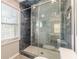 Modern bathroom shower with stylish tile, glass door, and bright lighting at 1118 Glenwood Se Ave, Atlanta, GA 30316
