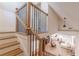 Elegant staircase with dark metal spindles opening to a bright living room at 1118 Glenwood Se Ave, Atlanta, GA 30316