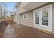 Exterior back deck of the home featuring wood flooring and white french doors at 144 Grayland Hills Ct, Lawrenceville, GA 30046