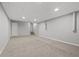 Open basement area featuring a drop ceiling, neutral walls, and carpet flooring at 144 Grayland Hills Ct, Lawrenceville, GA 30046