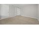 Basement with neutral walls, carpet flooring, and multiple closets at 144 Grayland Hills Ct, Lawrenceville, GA 30046