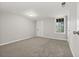 Basement with neutral walls, carpet flooring, a window, and access to the exterior at 144 Grayland Hills Ct, Lawrenceville, GA 30046