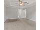 Bedroom with neutral tones, carpet, ceiling fan, and open doorway at 144 Grayland Hills Ct, Lawrenceville, GA 30046