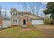 Charming two-story home with brick accents, attached garage, and well-maintained lawn in a peaceful neighborhood at 144 Grayland Hills Ct, Lawrenceville, GA 30046