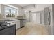 Bright kitchen featuring stainless steel appliances, white cabinetry, and large windows for ample natural light at 144 Grayland Hills Ct, Lawrenceville, GA 30046