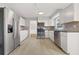 Well-lit kitchen featuring stainless steel appliances, granite countertops, and white cabinetry at 144 Grayland Hills Ct, Lawrenceville, GA 30046