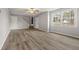 Inviting living room with updated flooring, neutral paint, and large windows offering plenty of natural light at 144 Grayland Hills Ct, Lawrenceville, GA 30046