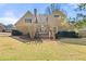 Exterior back of the house with a large yard and deck at 3287 Belmont Glen Se Dr, Marietta, GA 30067