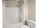 Bathroom featuring a tub with white tile surround and white fixtures at 3287 Belmont Glen Se Dr, Marietta, GA 30067