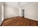 Bedroom featuring hardwood floors, neutral walls, and a large closet at 3287 Belmont Glen Se Dr, Marietta, GA 30067