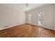 Bedroom featuring hardwood floors, neutral walls, and shutters at 3287 Belmont Glen Se Dr, Marietta, GA 30067