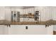Kitchen island with granite countertops, stainless steel appliances, and white cabinetry at 3287 Belmont Glen Se Dr, Marietta, GA 30067