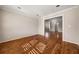 Living room showcasing hardwood floors, crown molding and ample space for entertaining at 3287 Belmont Glen Se Dr, Marietta, GA 30067