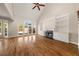 Spacious living room featuring hardwood floors, a fireplace, built-ins, and access to a deck at 3287 Belmont Glen Se Dr, Marietta, GA 30067