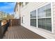 Wood deck outside of a home, showcasing the exterior siding and the surrounding yard at 1868 Appaloosa Mill Ct, Buford, GA 30519