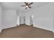 Bedroom with a ceiling fan, neutral walls and carpet, and an ensuite bathroom at 1868 Appaloosa Mill Ct, Buford, GA 30519