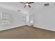Bedroom featuring a ceiling fan, neutral walls, and carpeted floors at 1868 Appaloosa Mill Ct, Buford, GA 30519