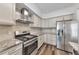 Kitchen featuring stainless steel appliances, granite countertops, and subway tile backsplash at 1868 Appaloosa Mill Ct, Buford, GA 30519