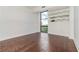 The bedroom has hardwood floors, a large window with a city view, and a modern decorative mirror at 375 Ralph Mcgill Ne Blvd # 807, Atlanta, GA 30312