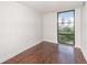 Cozy bedroom featuring hardwood floors, and a large window with city skyline views at 375 Ralph Mcgill Ne Blvd # 807, Atlanta, GA 30312