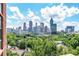 Stunning city views showcase Atlanta's skyline beyond the lush trees, creating an urban oasis at 375 Ralph Mcgill Ne Blvd # 807, Atlanta, GA 30312