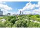 A scenic view of the city skyline from a lush green area at 375 Ralph Mcgill Ne Blvd # 807, Atlanta, GA 30312