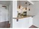 Kitchen view with bar top counter and stainless steel appliances, pendant lighting and hardwood floors at 375 Ralph Mcgill Ne Blvd # 807, Atlanta, GA 30312