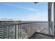 Condo balcony view overlooking the city skyline and distant treetops at 855 Peachtree Ne St # 2912, Atlanta, GA 30308