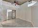 Bedroom with tile floors, ceiling fan, and closet with mirrored doors at 855 Peachtree Ne St # 2912, Atlanta, GA 30308