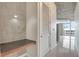 Hallway featuring tile floors, and a desk near a window at 855 Peachtree Ne St # 2912, Atlanta, GA 30308