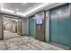Hallway with elevator access and multiple doors at 855 Peachtree Ne St # 2912, Atlanta, GA 30308