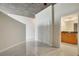 Hallway featuring tile floors, a bathroom, and a large closet for storage at 855 Peachtree Ne St # 2912, Atlanta, GA 30308