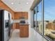 Modern kitchen with stainless steel appliances, granite countertops, and city views at 855 Peachtree Ne St # 2912, Atlanta, GA 30308