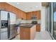 Modern kitchen with stainless steel appliances, granite countertops, and center island at 855 Peachtree Ne St # 2912, Atlanta, GA 30308