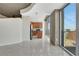 Open-concept living room with adjacent kitchen area featuring modern appliances and ample natural light at 855 Peachtree Ne St # 2912, Atlanta, GA 30308