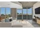 Bright living room with large windows offering city views, modern decor, and stylish furnishings at 855 Peachtree Ne St # 2912, Atlanta, GA 30308