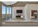 Cozy living room with sleek entertainment center and large windows offering city views at 855 Peachtree Ne St # 2912, Atlanta, GA 30308