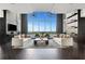 Spacious living room with hardwood floors and floor to ceiling windows overlooking the city at 855 Peachtree Ne St # 2912, Atlanta, GA 30308