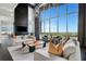 Spacious living room with hardwood floors and floor-to-ceiling windows overlooking the city at 855 Peachtree Ne St # 2912, Atlanta, GA 30308